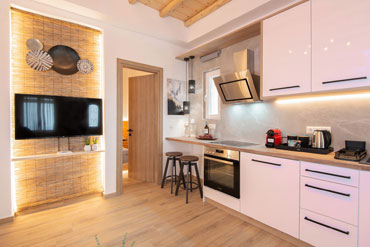 The kitchen and the lounge of the Sunset coast house wood