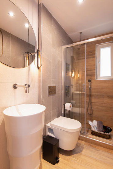Modern bathroom at sunset coast house wood
