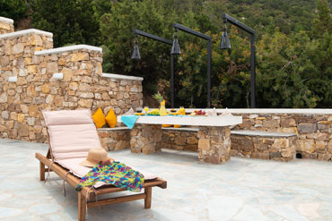 Veranda with sunbeds and sea view at sunset coast house wood