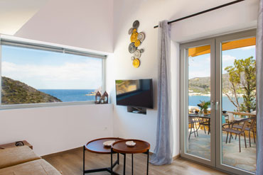 Living room with sea view at Sunset coast house Stone Sifnos